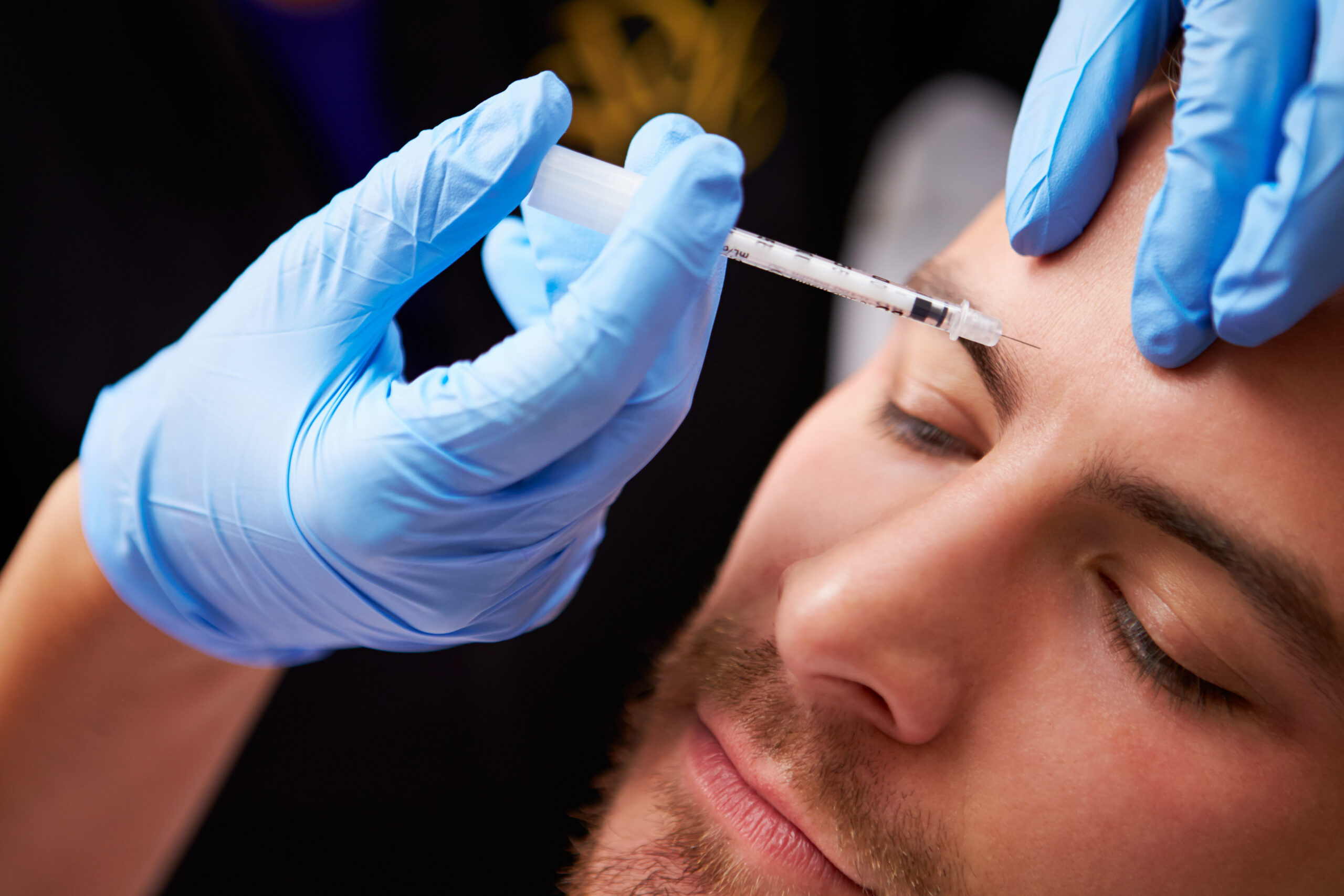 Board-certified dermatologist performing Botox treatment at The Dermatology Group